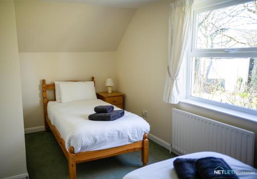 En eller flere senge i et værelse på Stone Hall Mill Cottage, Welsh Hook