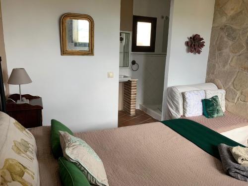 a bedroom with a bed and a fireplace at El Pósito in Hita