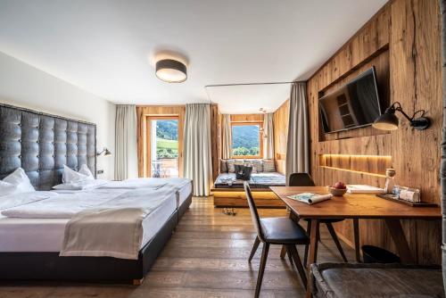Posteľ alebo postele v izbe v ubytovaní Dolomiten Residenz - Sporthotel Sillian