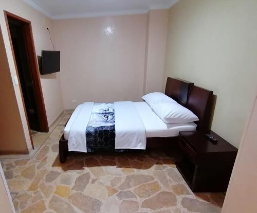 Postel nebo postele na pokoji v ubytování HOTEL GOLDEN SUITE