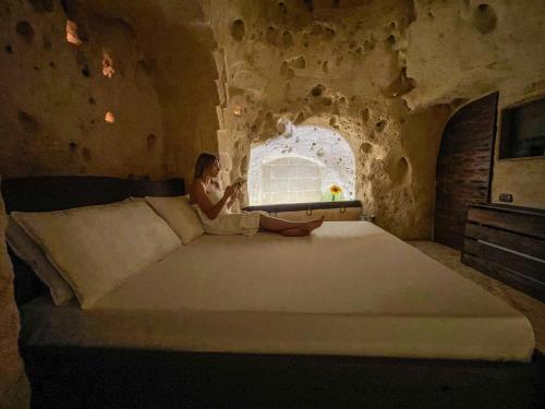 Giường trong phòng chung tại La Suite Nella Roccia