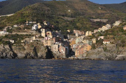 a view of a town on a hill from the water at Suite 5 Terre-Sea View in Riomaggiore