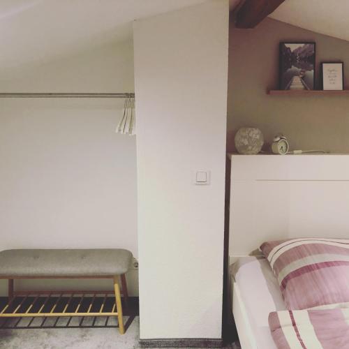 a bedroom with a bed and a desk in it at Ferienhaus am Hahnenkopf in Rübeland
