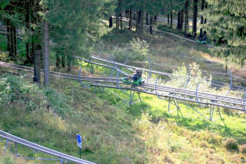a person riding a roller coaster down a hill at Ferienhaus Sequoia Hahnenklee in Hahnenklee-Bockswiese