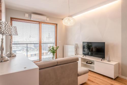 TV a/nebo společenská místnost v ubytování Dream4You Apartments