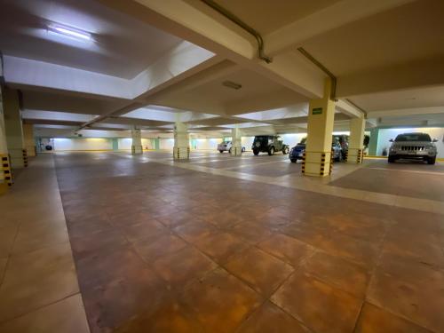an empty parking garage with cars parked in it at HOTEL MARIA RICO in Mexico City