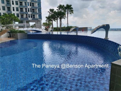 a swimming pool in the middle of the water at The Paneya @Benson Apartment in Surabaya