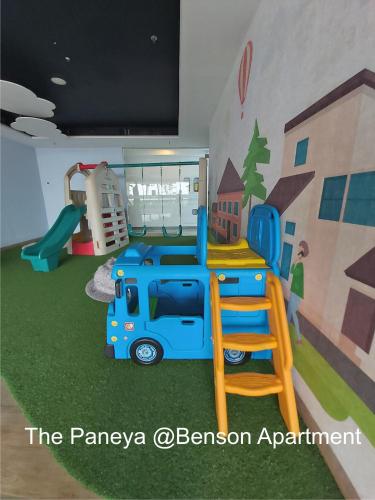a play room with a bus mural on the wall at The Paneya @Benson Apartment in Surabaya