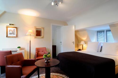Postel nebo postele na pokoji v ubytování Hotel Albert I