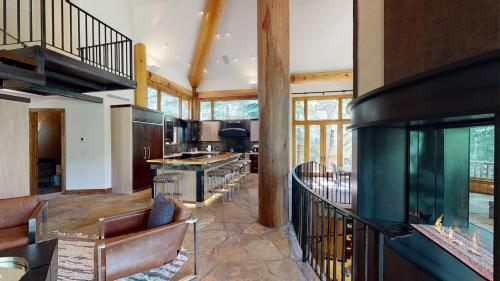 a large living room with a large fish tank at Vail Residences at Cascade Village, a Destination by Hyatt Residence in Vail