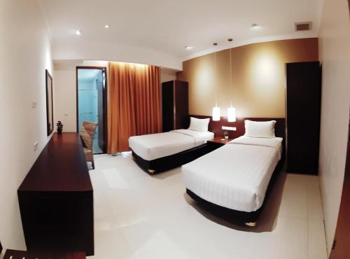 PEPABRI Hotel & Resort 객실 침대