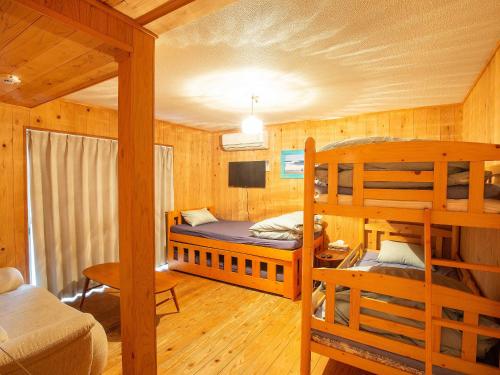 Postel nebo postele na pokoji v ubytování Tabist Guest house Pumping Surf