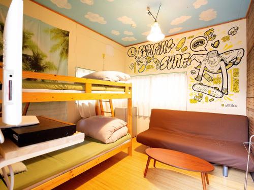 Postel nebo postele na pokoji v ubytování Tabist Guest house Pumping Surf