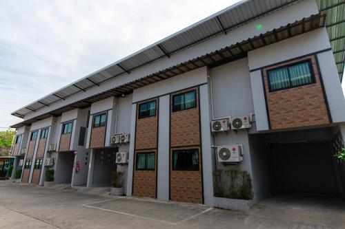 a rendering of a building with a garage at Matini Klong1 in Ban Talat Rangsit