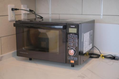 a microwave oven sitting on top of a counter at Megu Fuji 2021 in Fujiyoshida