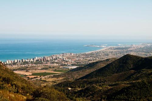 a view of a city from the top of a mountain at Hotel Sunna Benicassim in Benicàssim