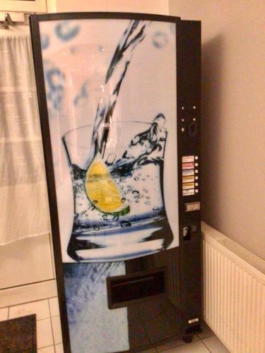 a picture of a glass of water in a microwave at Pension Claudia in Vösendorf
