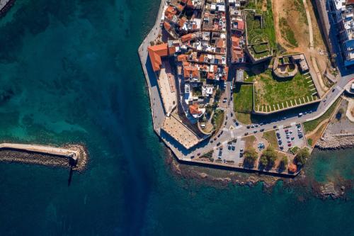 an aerial view of an island in the water at San Salvatore Monastery in Chania