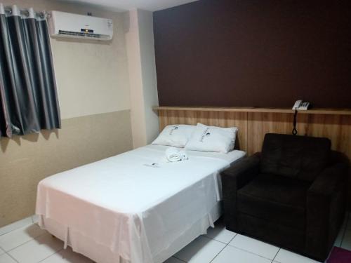 Ένα ή περισσότερα κρεβάτια σε δωμάτιο στο Borges Hotel