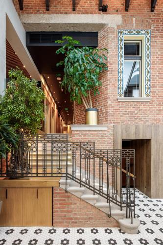 a brick building with a staircase and a fireplace at SCHUSTER Boarding House in Braşov