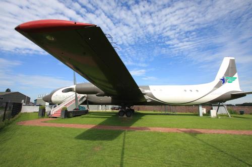 a plane on display on a grass field at Vliegtuigsuite Teuge in Teuge