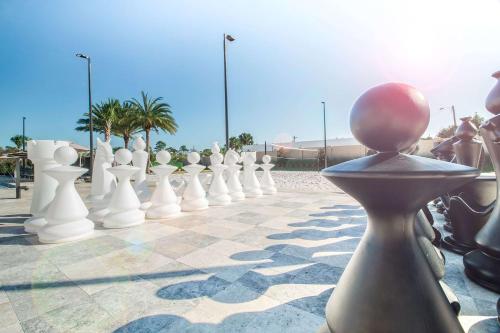 a large chess board with a person in the middle at Magic Village Views Trademark Collection by Wyndham in Orlando