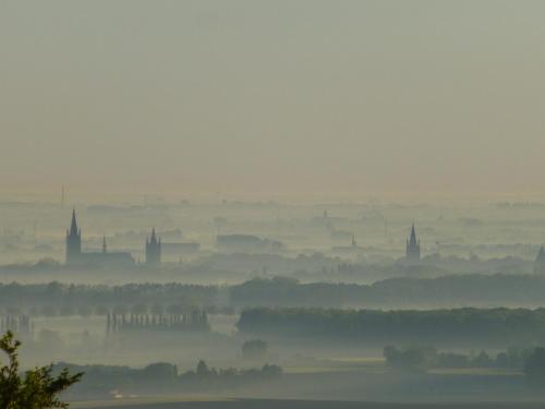 a foggy view of a city in the distance at B&B Haere Mai in Loker