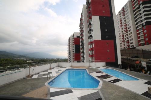 a swimming pool on the roof of a building at Apartment with VIEW to the CORDILLERA in Armenia