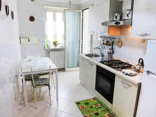 a kitchen with a sink and a stove top oven at Apartment Angelina by Interhome in Sorrento