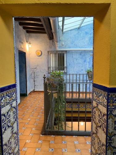 an open door of a building with a balcony at Pensión Lisdos in Seville