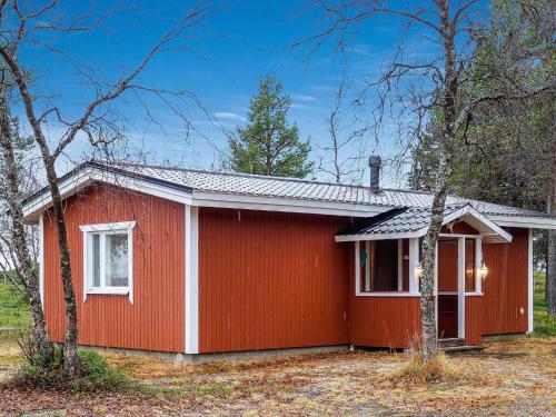 a red house with a white at Holiday Home Mellaniemi by Interhome in Hietajoensuu