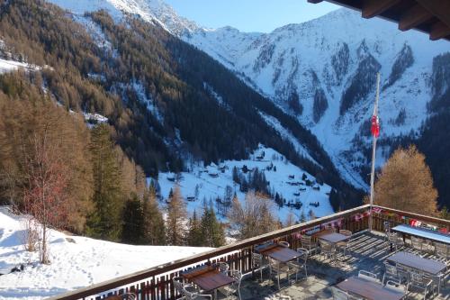 a ski lodge with a view of a snow covered mountain at Chalet des Alpes NATURE & MOUNTAIN by Alpvision Résidences in Prarion