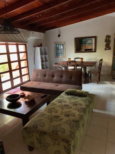 a living room with a couch and a table at Hostal Casaluna San Andres in San Andrés