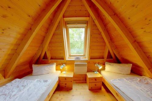 Una cama o camas en una habitación de Strandvogt 2 WS1