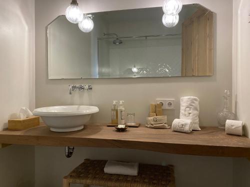 a bathroom with a sink and a mirror at Mas Generós - Adults-Only Eco Hotel in Fonteta