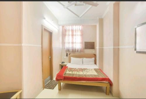 Postel nebo postele na pokoji v ubytování Hotel Queen