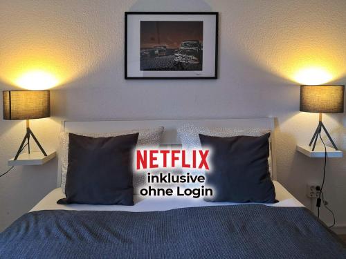 a bedroom with a bed with a netflix inclusive onion login pillow at Landlust Hotel in Gransee