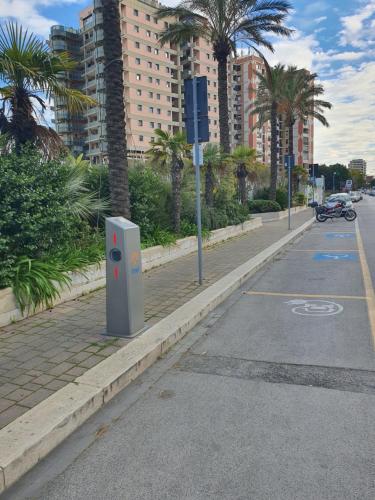 a street with palm trees on the side of the road at Redi Suite in Bari