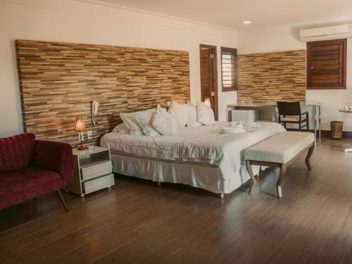 Postel nebo postele na pokoji v ubytování Hotel Vale das Nuvens