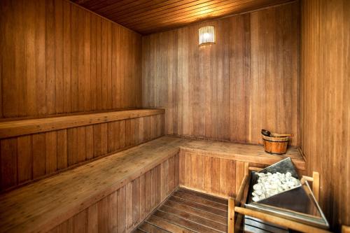 an empty wooden sauna with a bench in it at INNSiDE by Meliá São Paulo Iguatemi in Sao Paulo