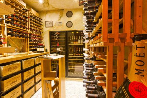 a wine cellar with a bunch of wine bottles at Holland House Beach Hotel in Philipsburg