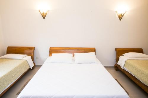 Ein Bett oder Betten in einem Zimmer der Unterkunft Hotel Pousada dos Condes