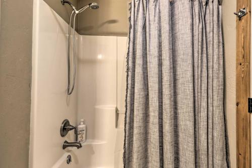a shower curtain in a bathroom with a sink at Columbia Falls Private Retreat Pool Table and Deck! in Columbia Falls