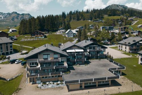 an aerial view of a village with houses at Wohlfühlresidenz auf dem Sonnenplateau in Amden