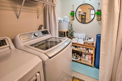a washing machine in a laundry room with a mirror at Pet-Friendly Gilford Home by Gunstock Ski Mountain in Gilford