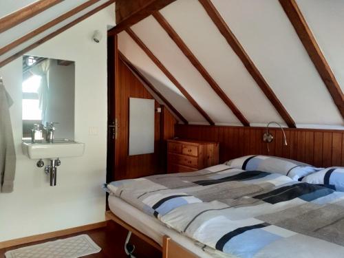 Säng eller sängar i ett rum på Rustico "Casa di Sasso"