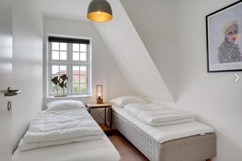 Postel nebo postele na pokoji v ubytování 3- Skøn og lyst indrettet ferielejlighed
