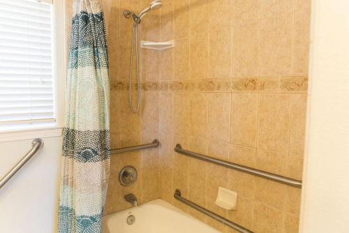 a bathroom with a shower with a shower curtain at 90 San Luis Street Unit C in Avila Beach