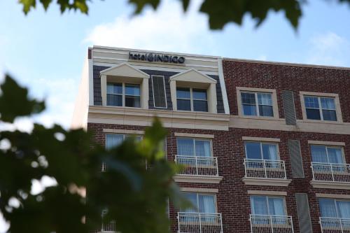 a building with the name of the building at Hotel Indigo Naperville Riverwalk by IHG in Naperville