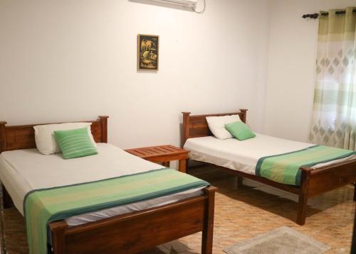 Tempat tidur dalam kamar di Thidasa Holiday Resort
